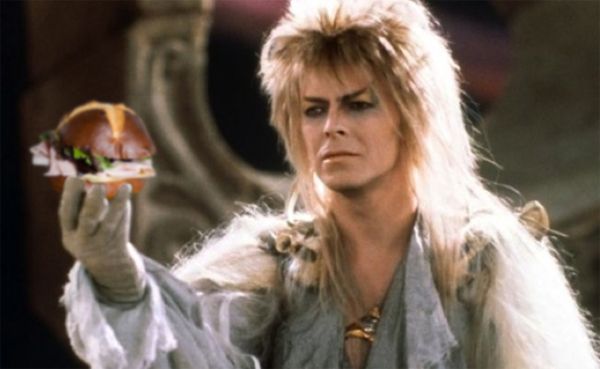 image of David Bowie as the Goblin King in Labyrinth, which I have photoshopped to make it look as though he's holding out a sandwich