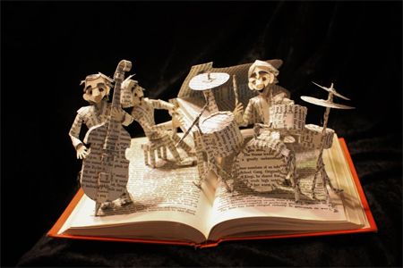image of a book sculpture in which a jazz band has been sculpted from the pages of the book
