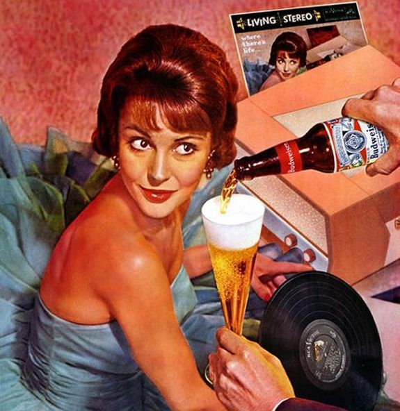 image of a woman sitting next to a record player, appearing to be on a date, while a man out of frame pours a Budweiser for her