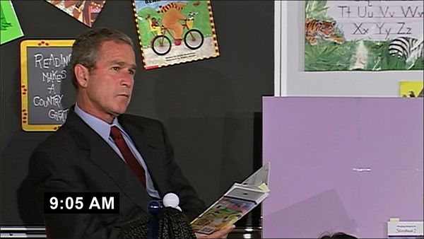 image of former President George W. Bush sitting and reading a children's book in a classroom at 9:05am on the morning of Sept. 11, 2001