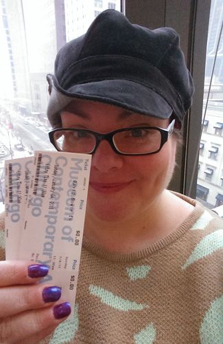 image of me holding up Iain's and my tickets to the show