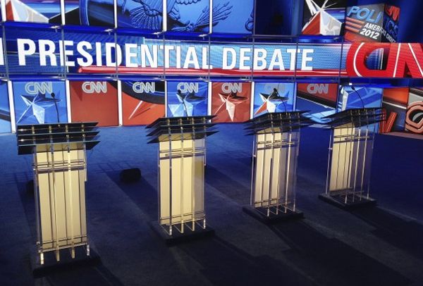 image of unoccupied podiums on a stage set for a presidential debate