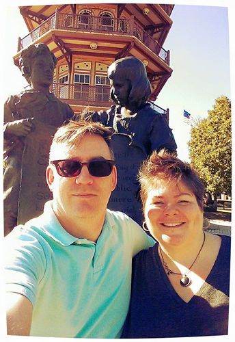 image of Deeky and me standing in front of a statue of children in a park in Baltimore