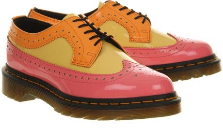 image of Doc Martens brand pink, yellow, and orange wing-tipped shoes