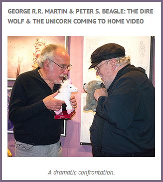 image of two older white men with beards; one is holding a stuffed unicorn and one is holding a stuffed wolf, and they are poised as if the plush toys are about to fight one another; the picture is labeled: 'GEORGE R.R. MARTIN & PETER S. BEAGLE: THE DIRE WOLF & THE UNICORN COMING TO HOME VIDEO: A dramatic confrontation.'