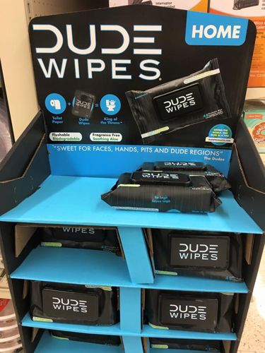 image of a display of 'Dude Wipes,' a personal hygiene product marketed to men for their 'faces, hands, pits, and dude regions'