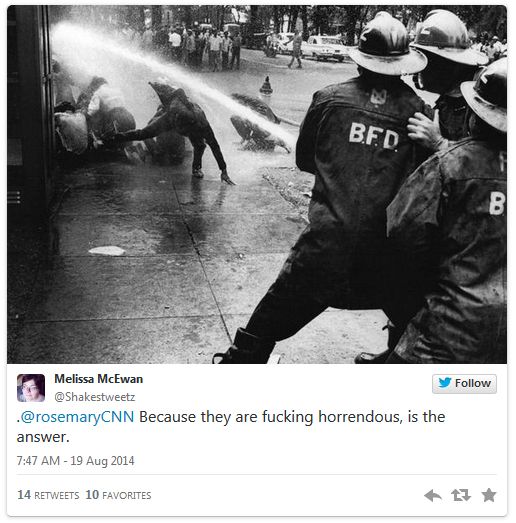 screen cap of a tweet authored by me reading '@rosemaryCNN Because they are fucking horrendous, is the answer.' and showing an old black and white image of fire department workers knocking over people with high pressure streams of water from water hoses