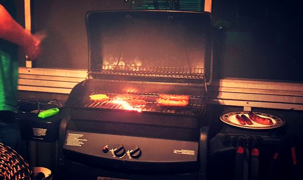 image of our grill cooking meat on our back porch