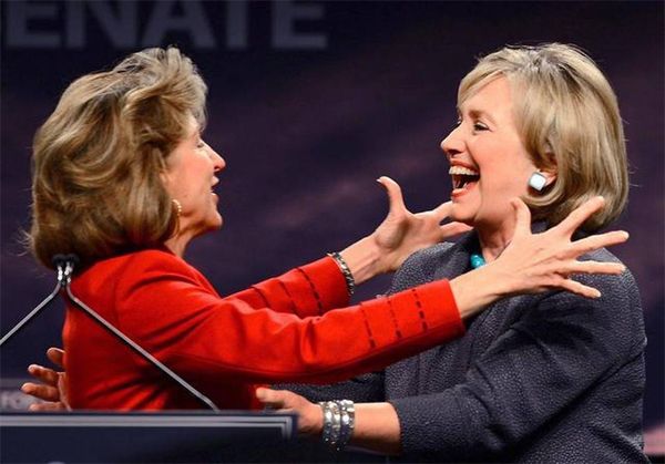 image of Hillary Clinton being warmly greeted by former Senator Kay Hagan, a thin white woman