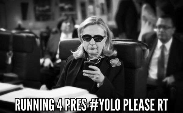 black and white iconic image of Hillary Clinton looking at her cell phone while wearing shades, to which I've added text reading: 'RUNNING 4 PRES #YOLO PLEASE RT'