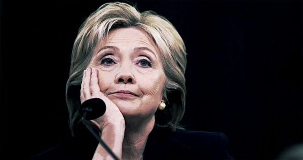 image of Hillary Clinton at the Benghazi hearing, with her chin in her hand and a slight smile on her face
