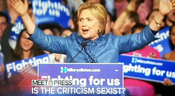 screen cap of Clinton during a campaign event, over which is text reading: 'Is the criticism sexist?'