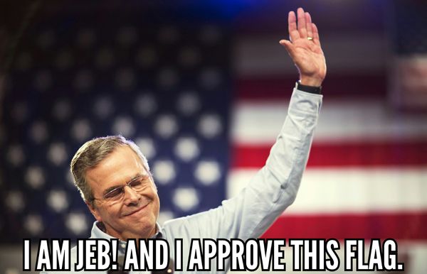 image of Jeb Bush standing in front of a giant US flag, to which I've added text reading: 'I am Jeb! and I approve this flag.'