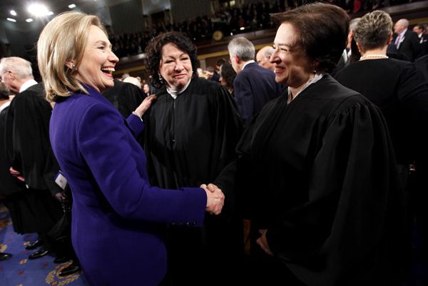 image of Hillary Clinton standing and laughing with Justice Elena Kagan, an in-betweenie white woman, and Justice Sonia Sotomayor, an in-betweenie Latina, at a State of the Union address