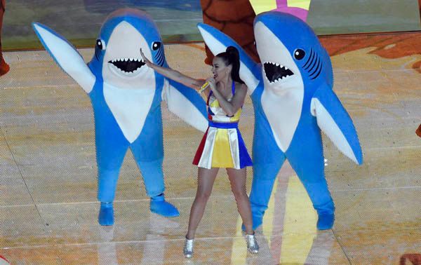 image of Katy Perry dancing with people in cartoonish shark costumes during the halftime show