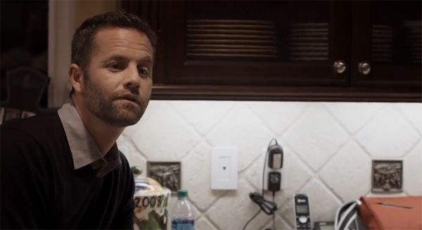 screen cap of Kirk Cameron standing in a kitchen looking confused