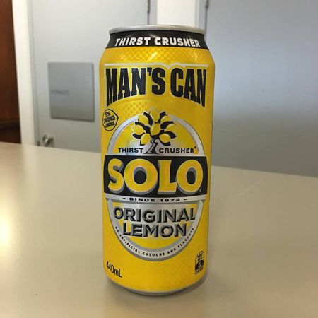 image of a Solo lemon-flavored fizzy drink can labeled 'MAN'S CAN' and 'THIRST CRUSHER'