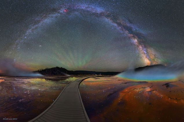 image of the Milky Way galaxy arching across the night sky, over Yellowstone National Park