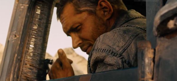 image of Tom Hardy as Mad Max, stoicly giving a thumbs-up