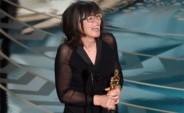 image of Margaret Sixel holding her Oscar onstage at the ceremony