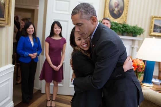 image of the President hugging nurse Nina Pham; he looks very relieved and serious and she is smiling