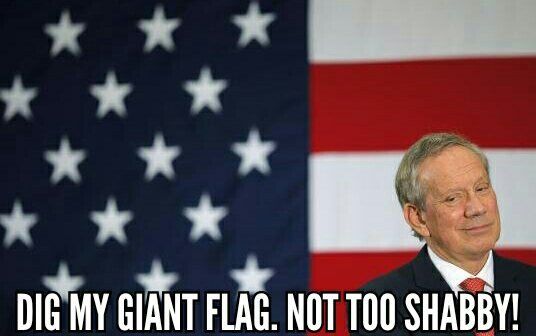 image of George Pataki standing in front of a huge US flag, looking smug, to which I've added text reading: 'Dig my giant flag. Not too shabby!'
