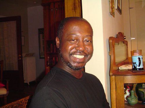 image of Phil Barron, a middle-aged black man with a mustache and beard; he is looking at the camera and smiling broadly
