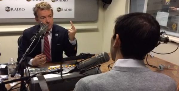 image of Rand Paul extending his middle finger at the dude interviewing him