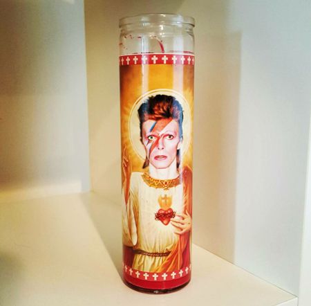 image of a votive candle featuring David Bowie as a saint
