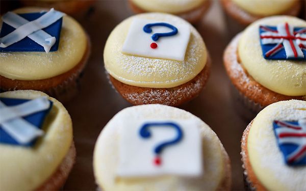image of three rows of cupcakes; the first decorated with the Scottish flag, the middle decorated with question marks, and the last decorated with Union Jacks