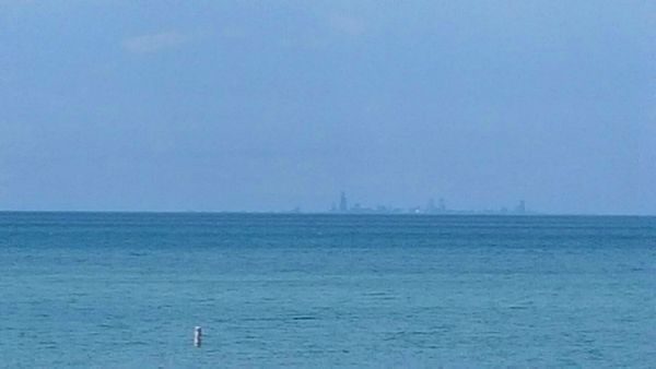 image of the Chicago skyline in the distance over the lake