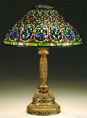 image of a dragonfly Tiffany lamp with a gold base