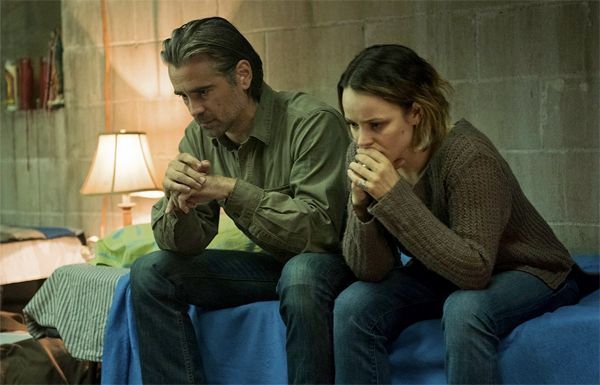 image of Colin Farrell and Rachel McAdams sitting beside each other on a bed looking worried, in a scene from True Detective, Season 2
