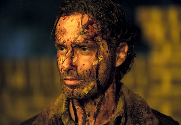 image of Grimes, with bandages and streaks of blood all over his face