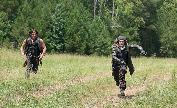 screen cap from The Walking Dead in which Daryl is chasing some new dude across a field