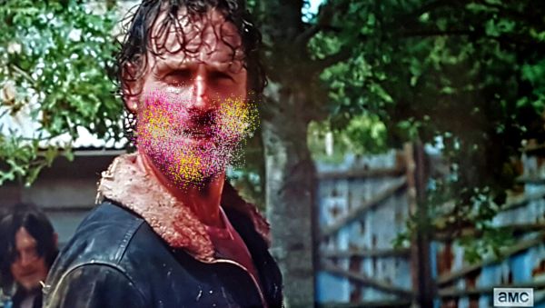 screen cap from The Walking Dead in which Grimes is standing and making a garbage face; I have replaced the blood on his face with glitter