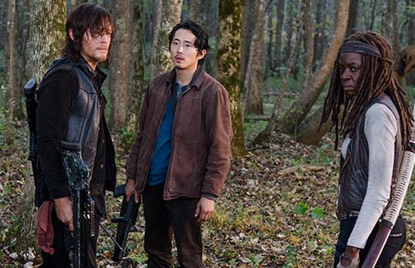screen cap from The Walking Dead of Daryl, Glenn, and Michonne standing in the woods; Glenn looks stricken