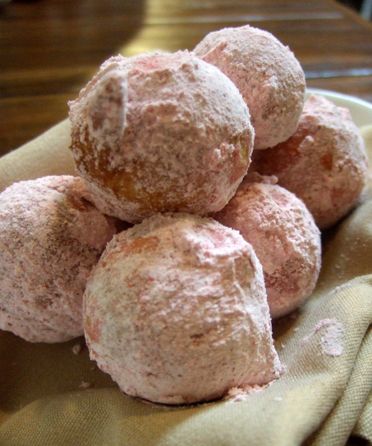 image of zeppelis, which are sweet powdered dough balls