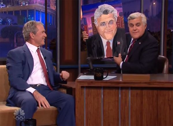 image of former President George W. Bush presenting a painting of Jay Leno to Jay Leno on The Tonight Show