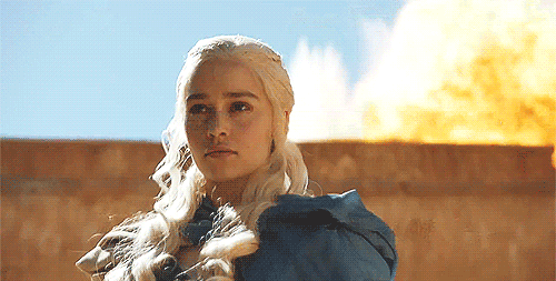 image of Daenerys, a young white woman, from Game of Thrones, with fire erupting behind her