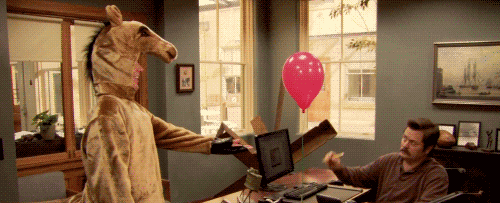 gif of Ron Swanson popping a balloon held by a person in a horse costume