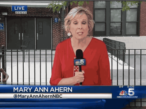 moving image of an adorable little black girl dancing into the screen in the background of a news report being done by Mary Ann Ahern, a middle-aged white woman