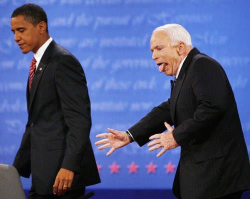 iconic image of John McCain with his tongue out while walking behind Barack Obama at a debate in 2008