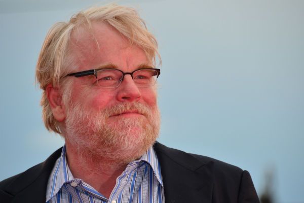 image of actor Philip Seymour Hoffman looking into the distance with a wry smile