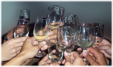 image of a bunch of hands lifting glasses in a big toast