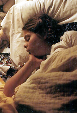 image of me asleep as a little girl with Princess Leia buns in my hair