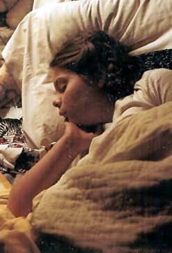 image of me asleep as a little girl with my braided hair done in Princess Leia buns