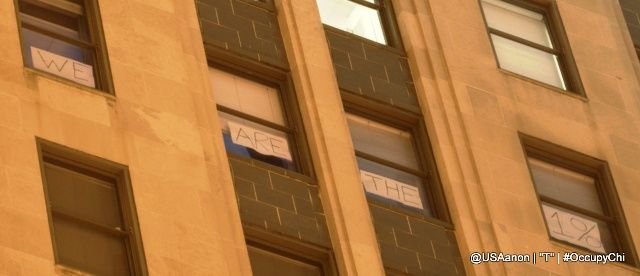 image of the Chicago Board of Trade with a message reading 'We Are the 1%' in the windows