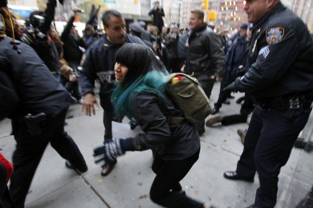 an Occupy Wall Street protestor is shoved by police, making arrests in NYC