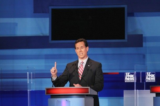 image of Rick Santorum during a debate raising his finger in protest